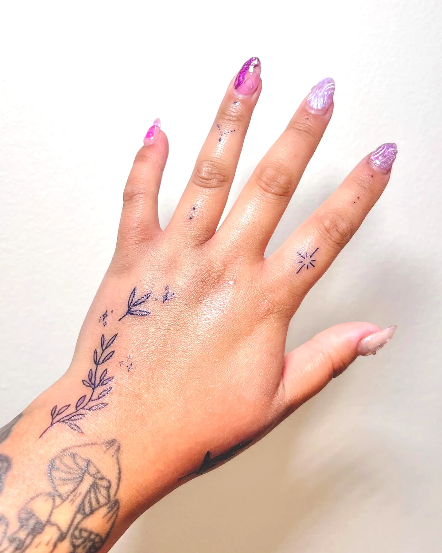 Dainty Floral Hand Tattoo with Stars