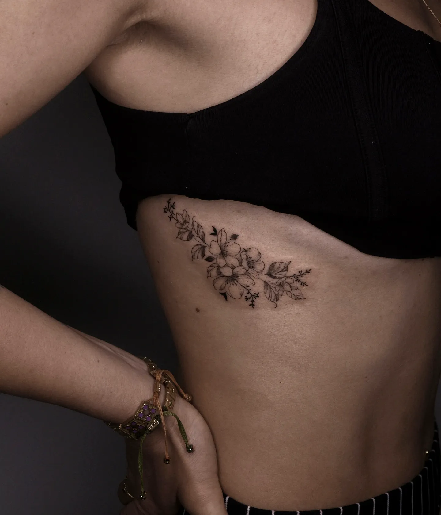 Dainty Floral Rib Tattoo in Black Ink