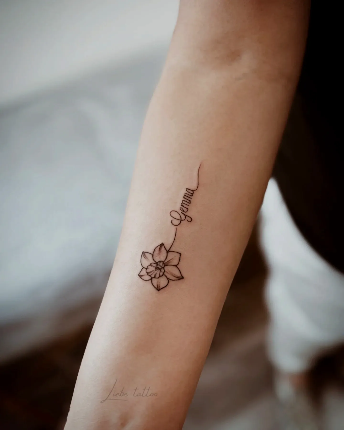 Dainty Flower Forearm Tattoo with Name