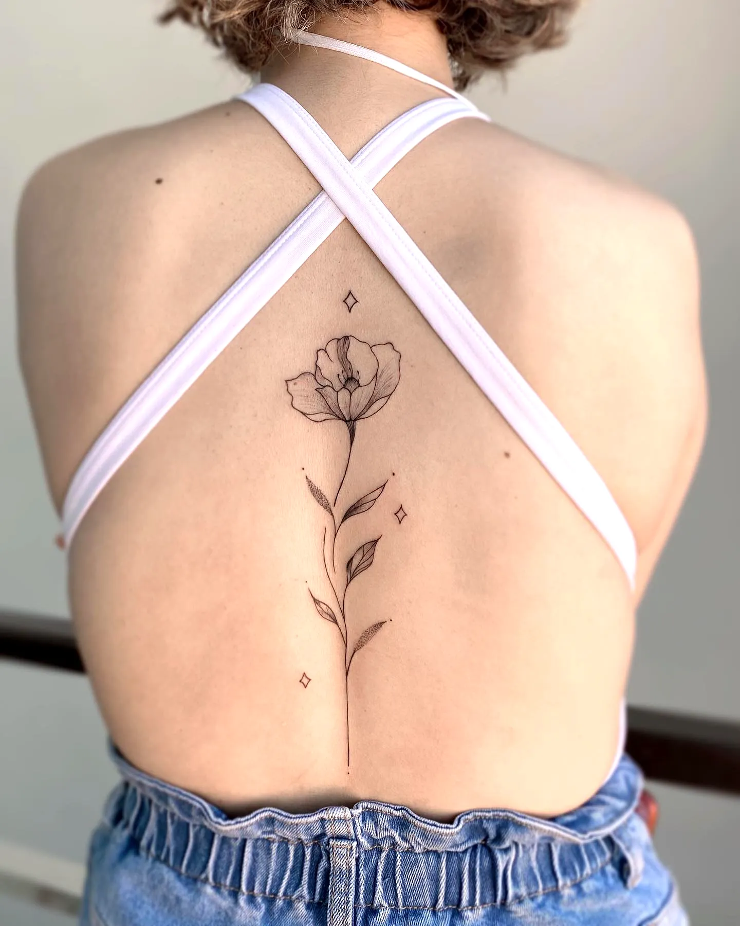 Dainty Flower Spine Tattoo with Diamonds