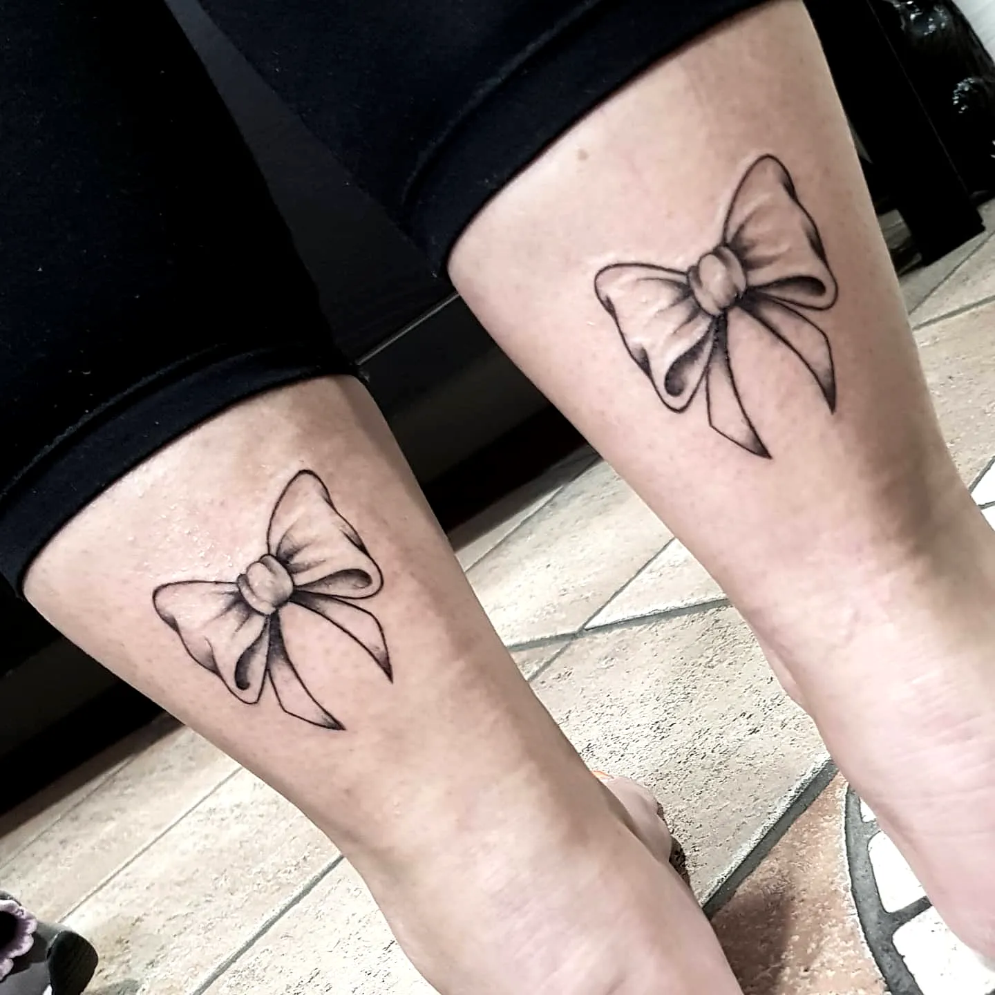 Dainty Ribbon Calf Tattoos in Line Art