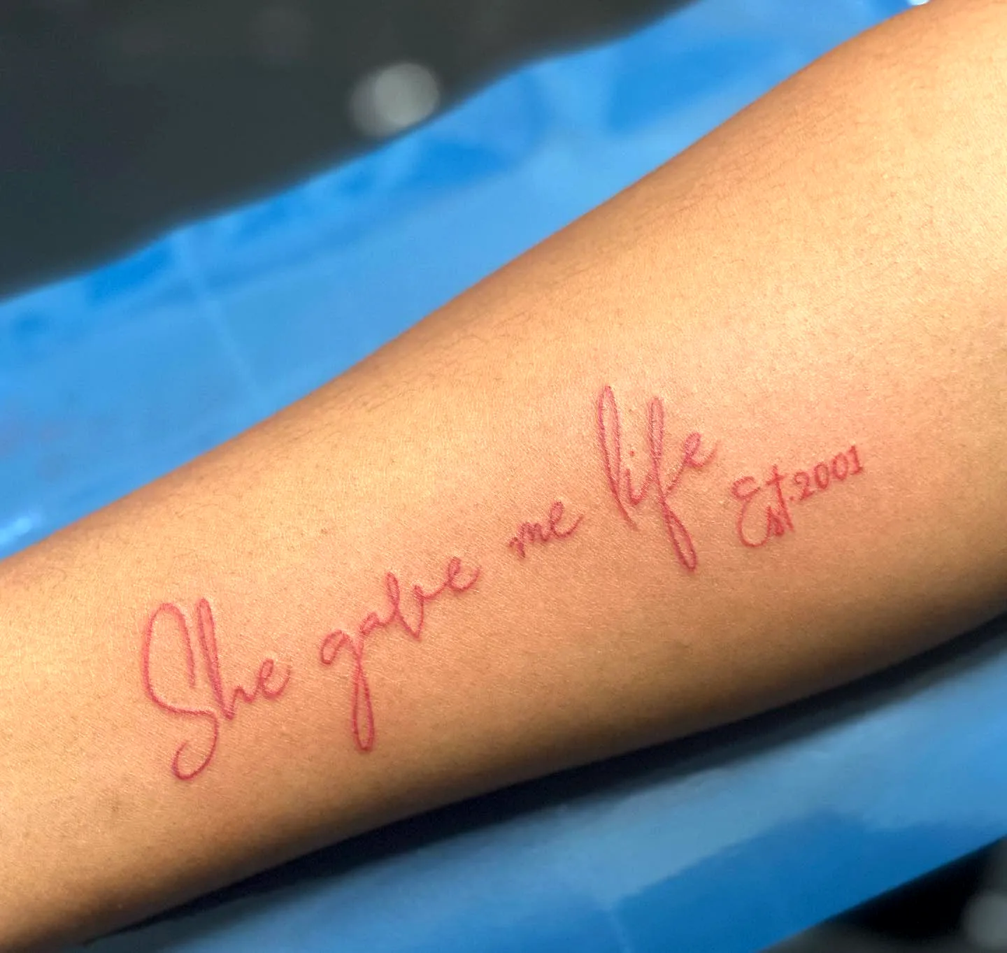 Daughter Forearm Tattoo in Red Cursive