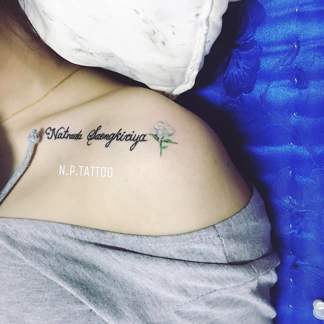 Delicate Shoulder Tattoo with Floral Elements