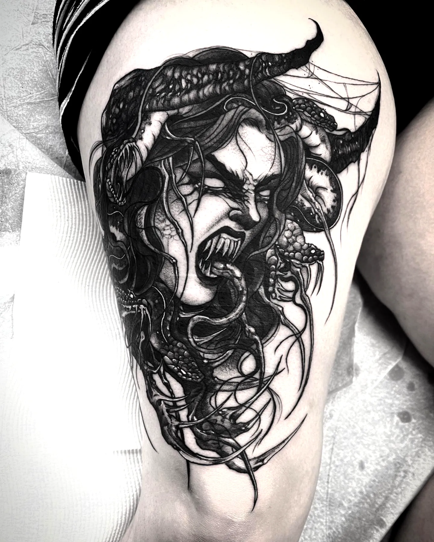 Demon Thigh Tattoo in Gothic Style