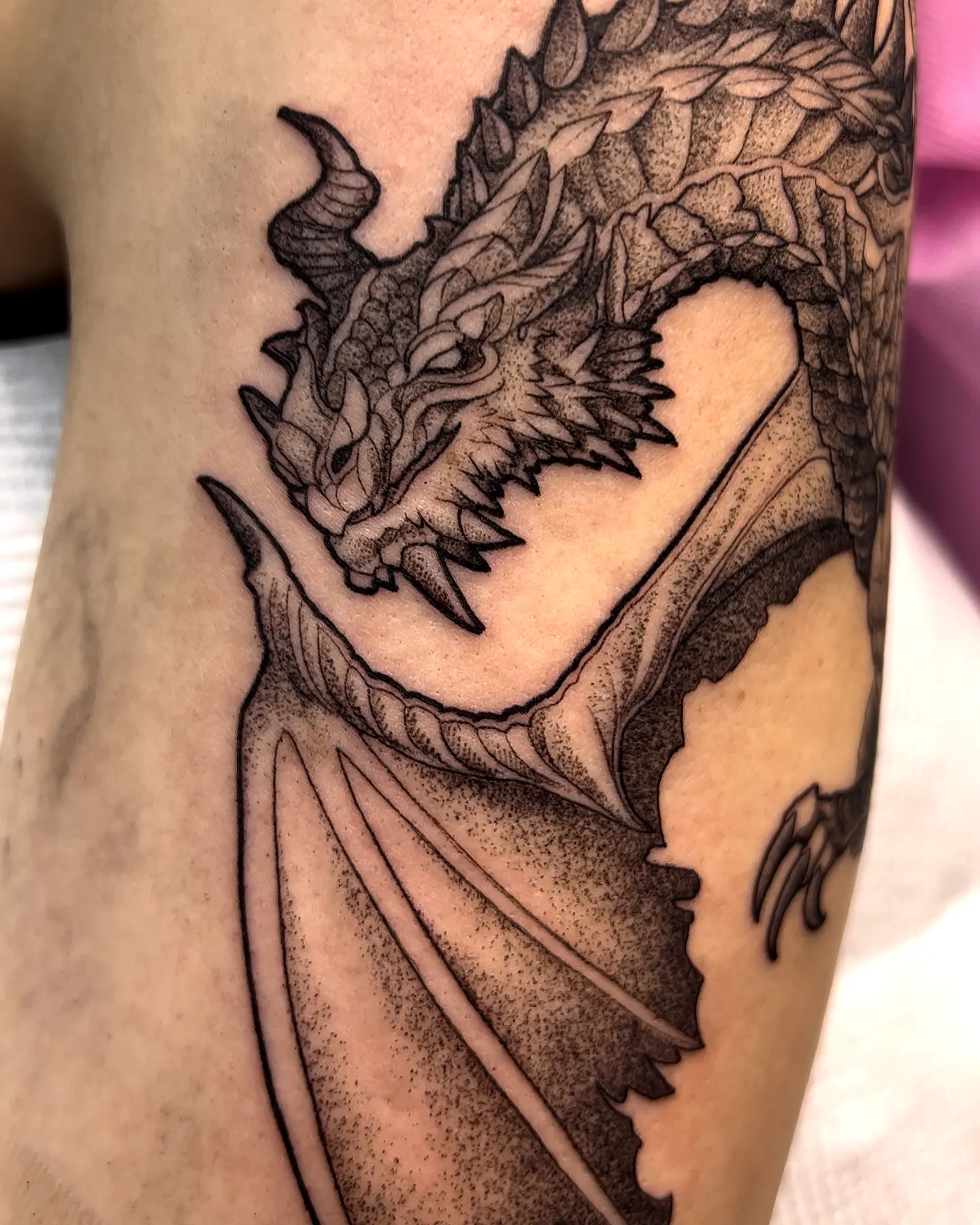 Dragon back tattoo in black ink