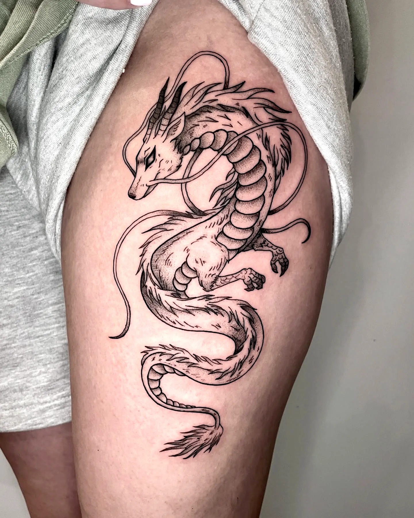 Dragon Thigh Tattoo with Intricate Shading