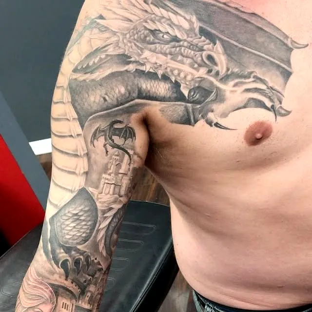 Dragon Upper Arm Tattoo with Castle and Bats