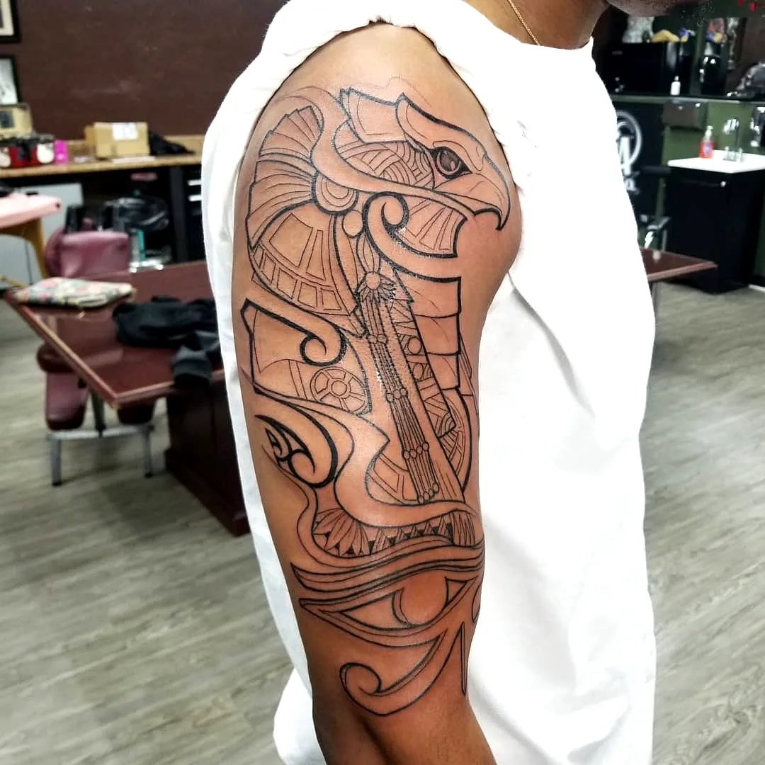 Eagle Head Upper Arm Tattoo with Egyptian Elements