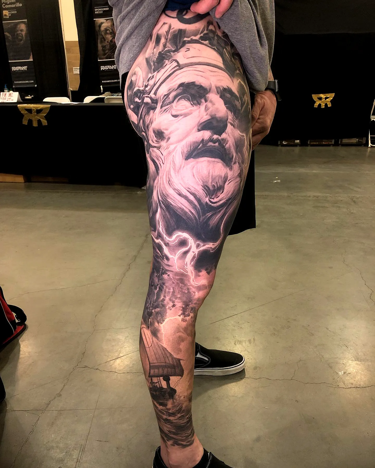 Elderly Man Leg Tattoo with Dramatic Clouds