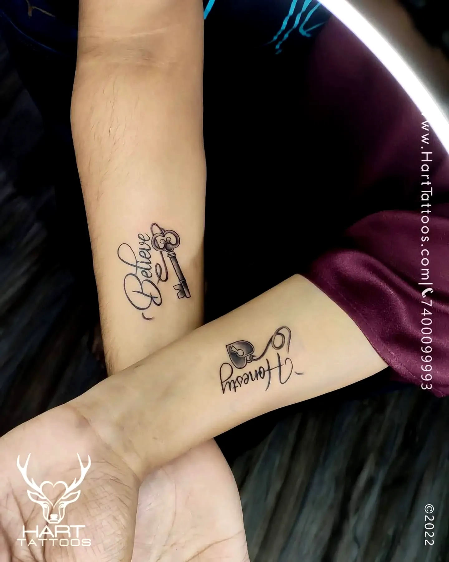 Elegant Script Arm Tattoo with Key