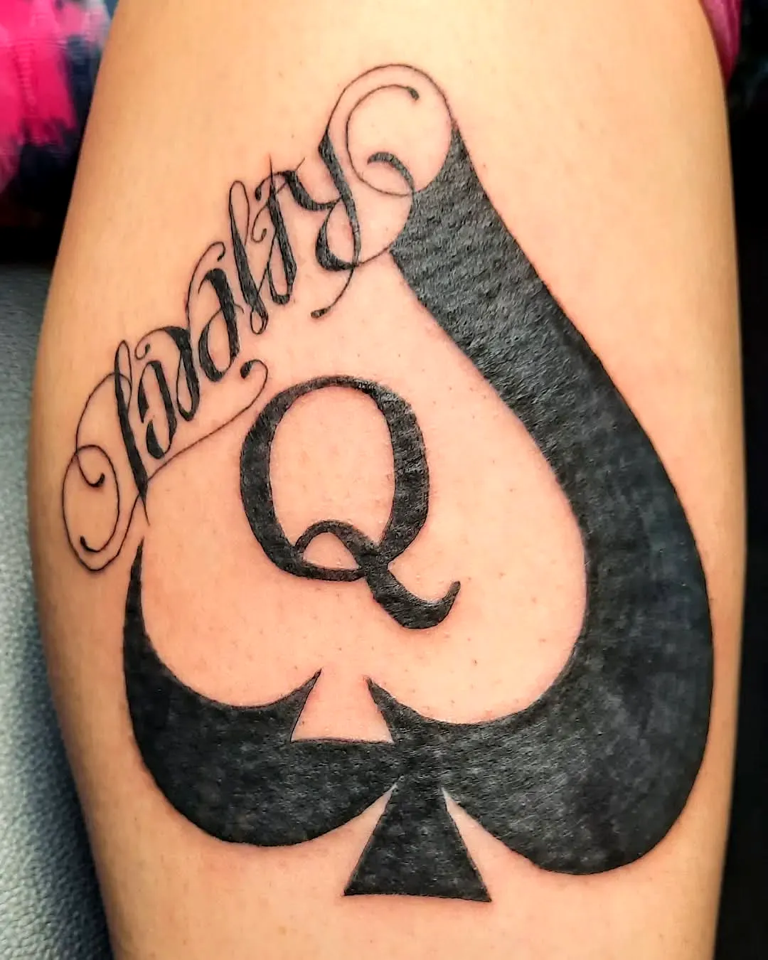 Elegant Spade Thigh Tattoo with Loyalty