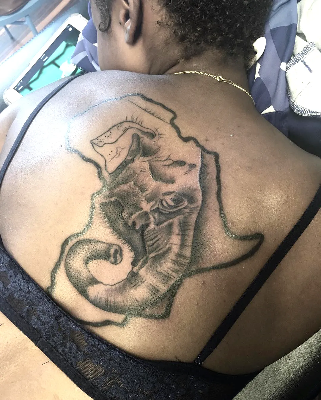 Elephant Upper Back Tattoo in Black Ink