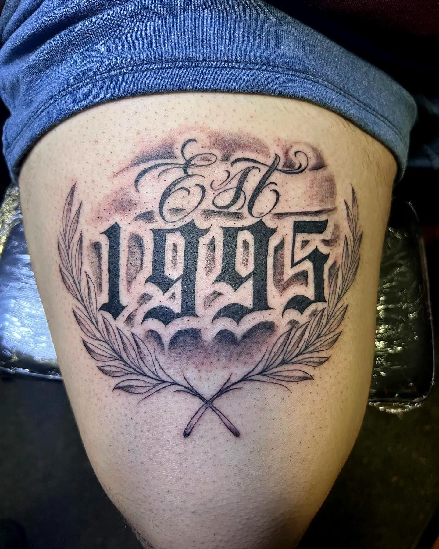 EST 1995 Thigh Tattoo with Laurel Wreath