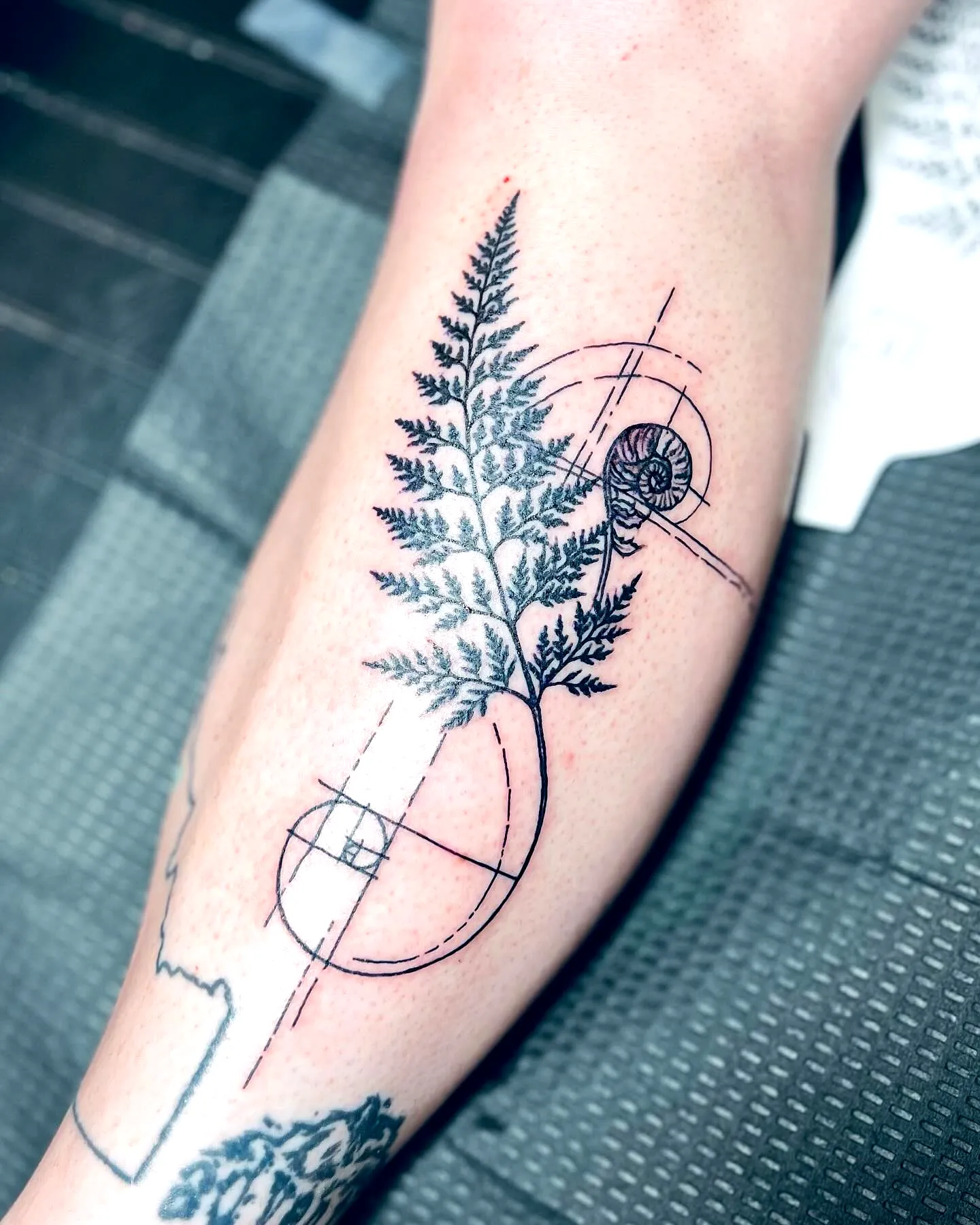 Fern Leg Tattoo with Geometric Elements