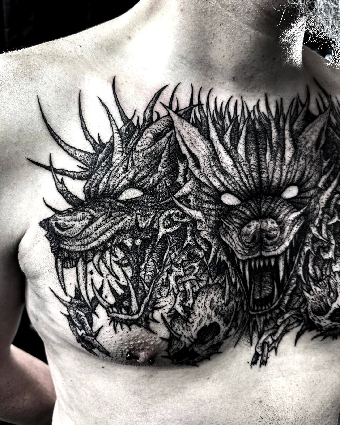 Ferocious Wolf Chest Tattoo in Black Ink