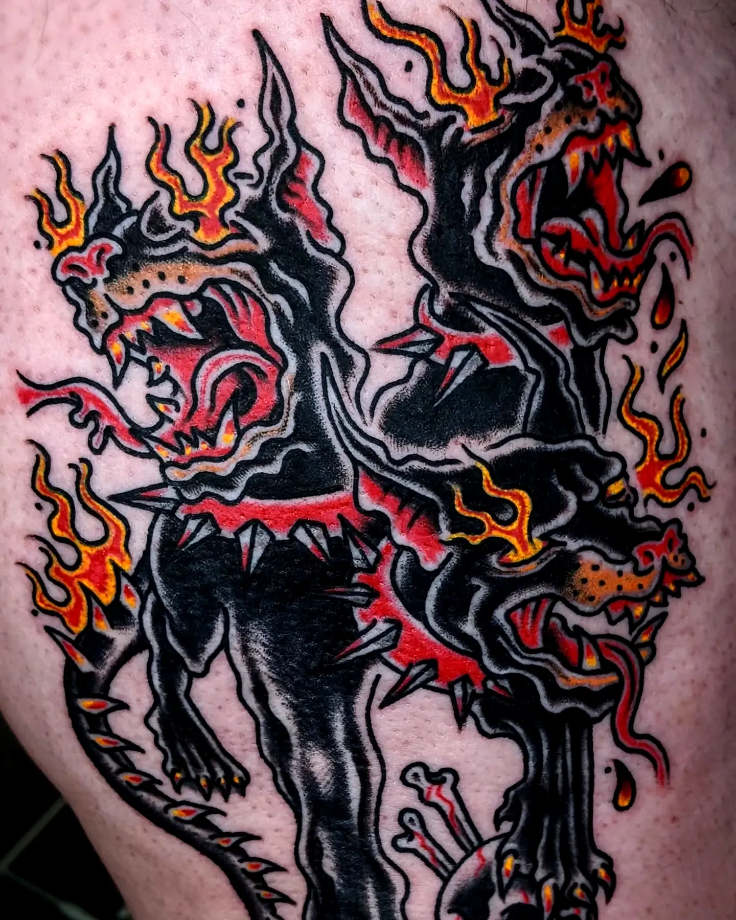 Fierce Cerberus Arm Tattoo with Flames