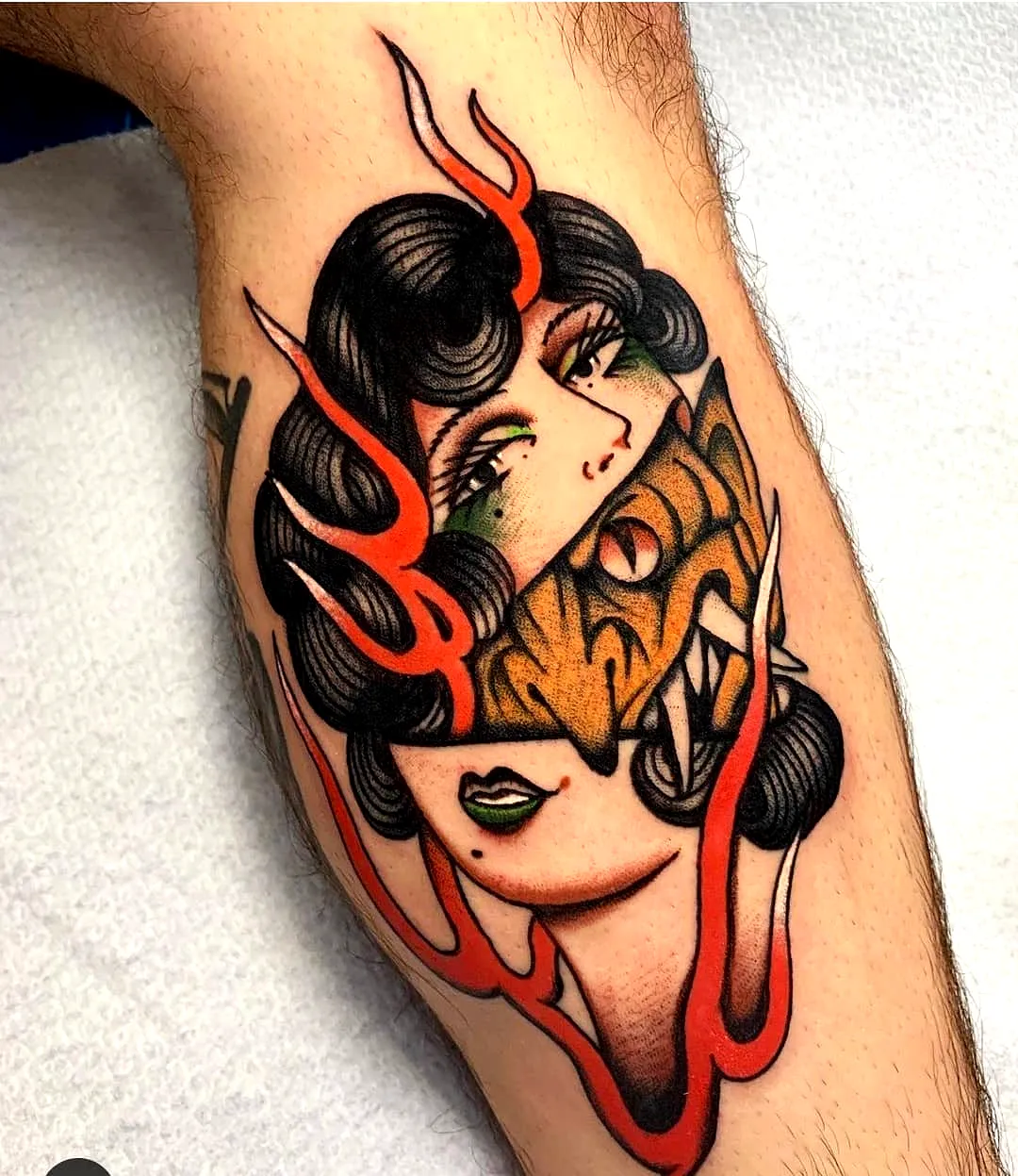 Fierce Tiger Leg Tattoo with Green Eyes