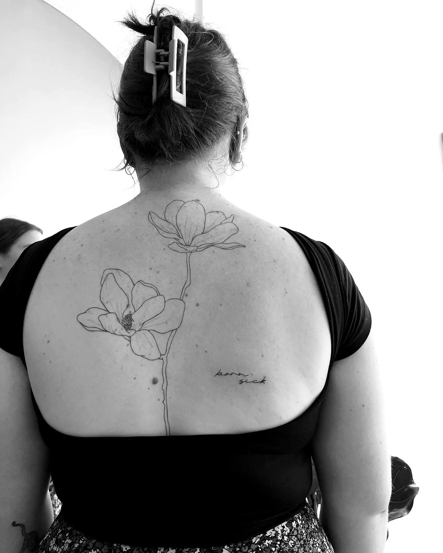 Floral Back Tattoo with Handwritten Phrase