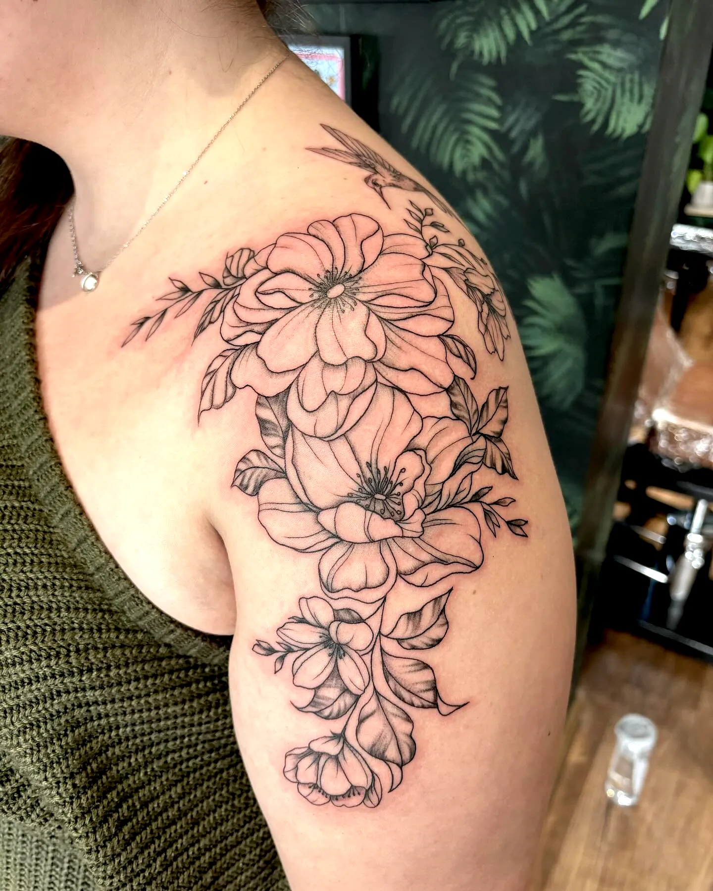 Floral Black Ink Upper Arm Tattoo