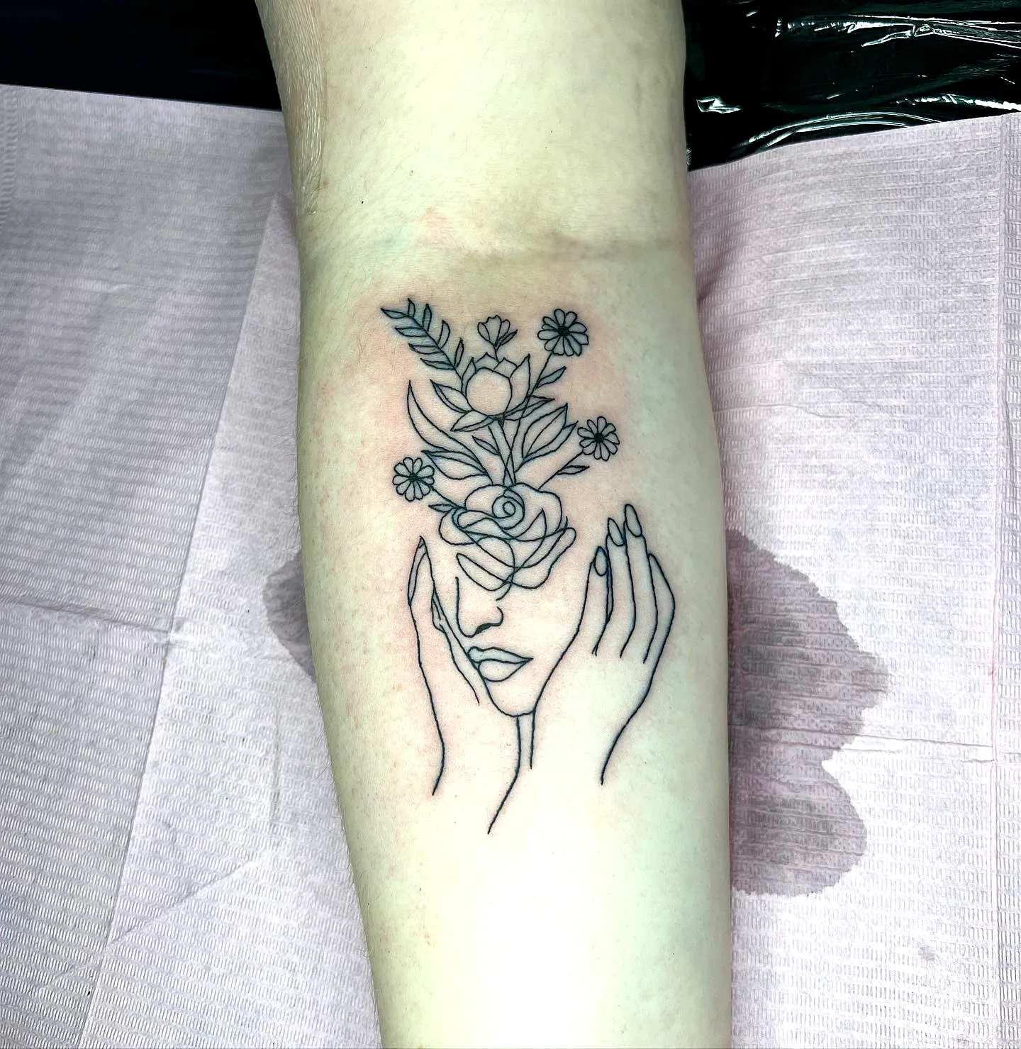 Floral Face Outline Forearm Tattoo