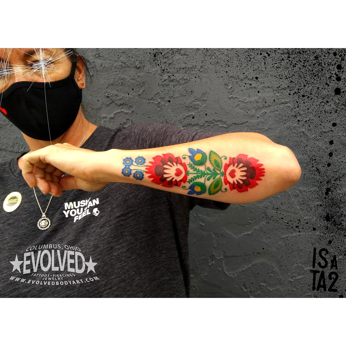 Floral Forearm Tattoo with Red and Blue Flowers
