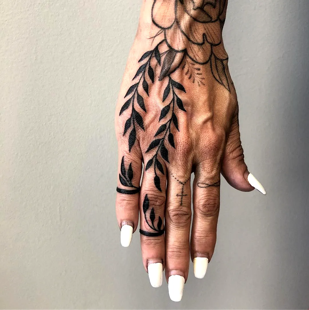 Floral Hand Tattoo with Black Line Work
