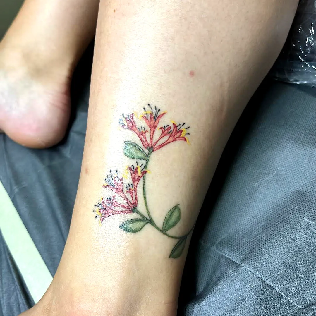 Floral Leg Tattoo with Pink and Yellow Flowers