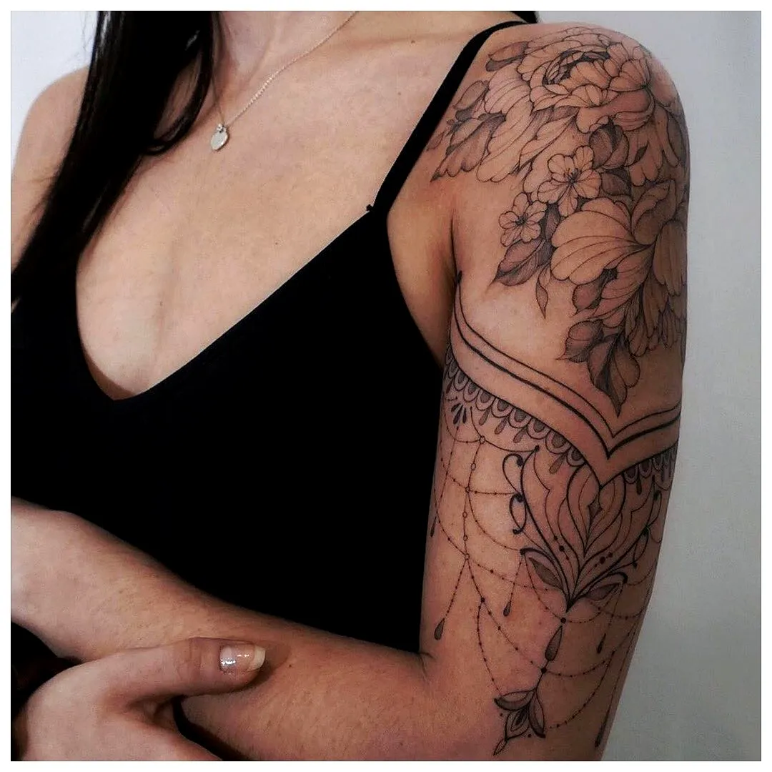Floral Upper Arm Tattoo in Black and Gray