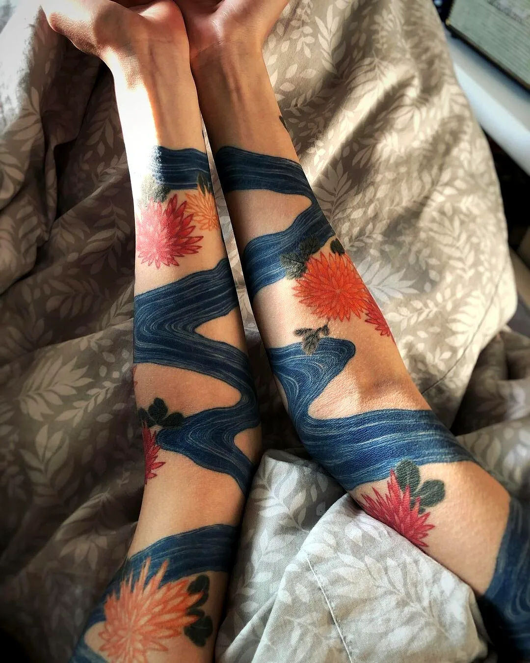 Flowing Waves and Flowers Forearm Tattoo