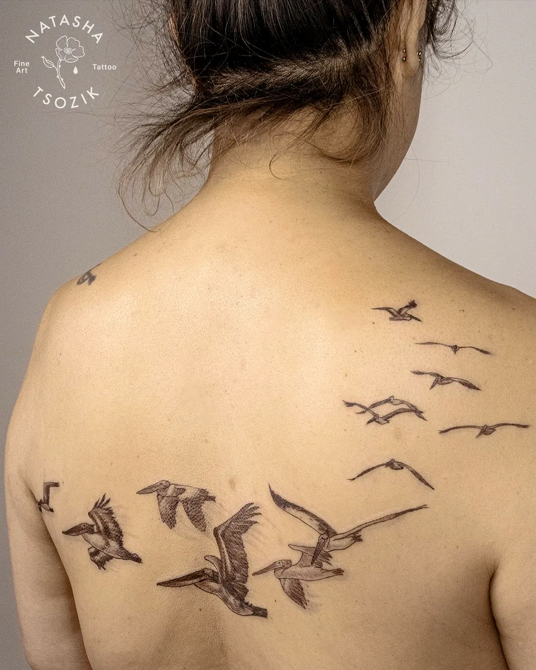 Flying Birds Upper Back Tattoo