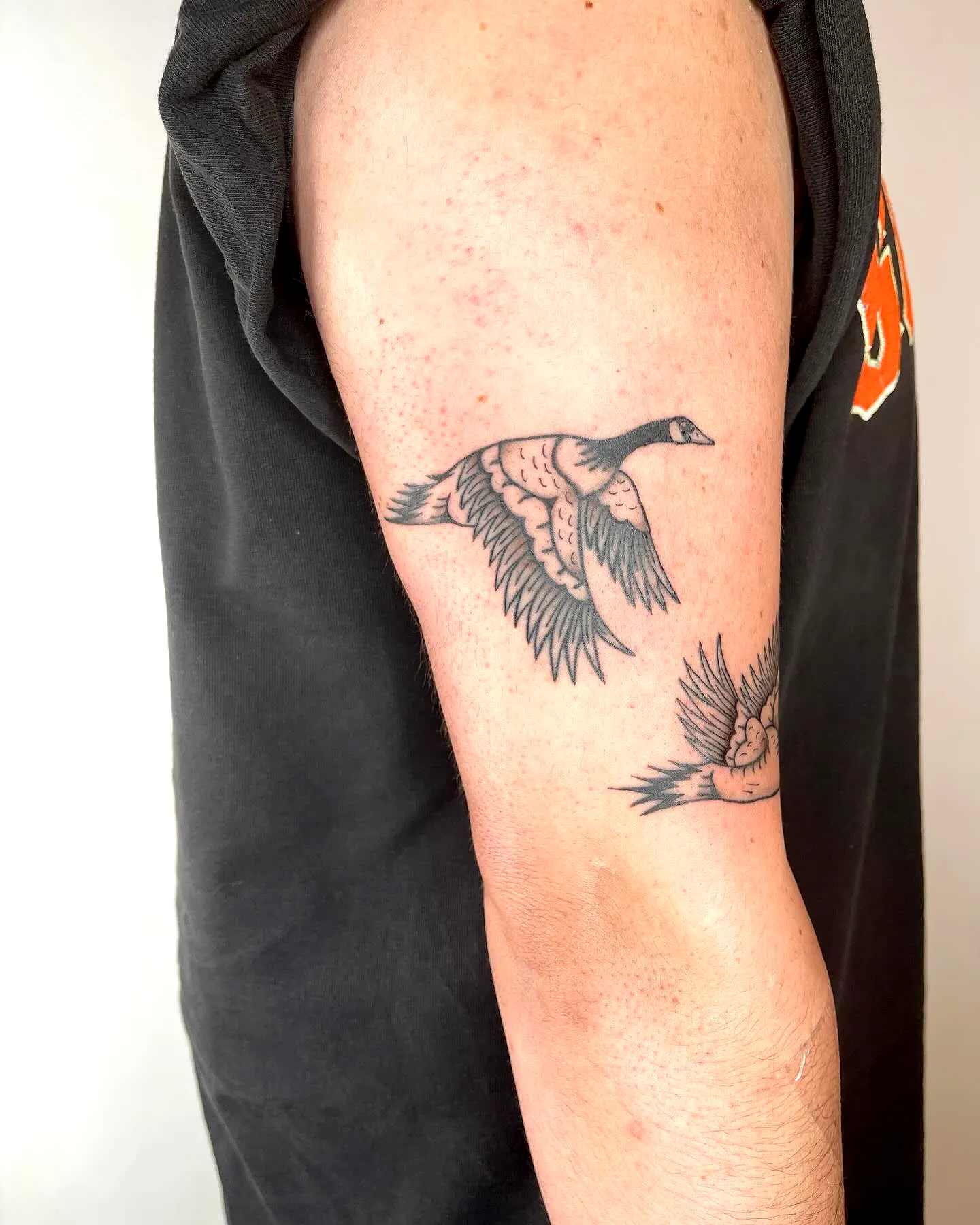 Flying Geese Upper Arm Tattoo