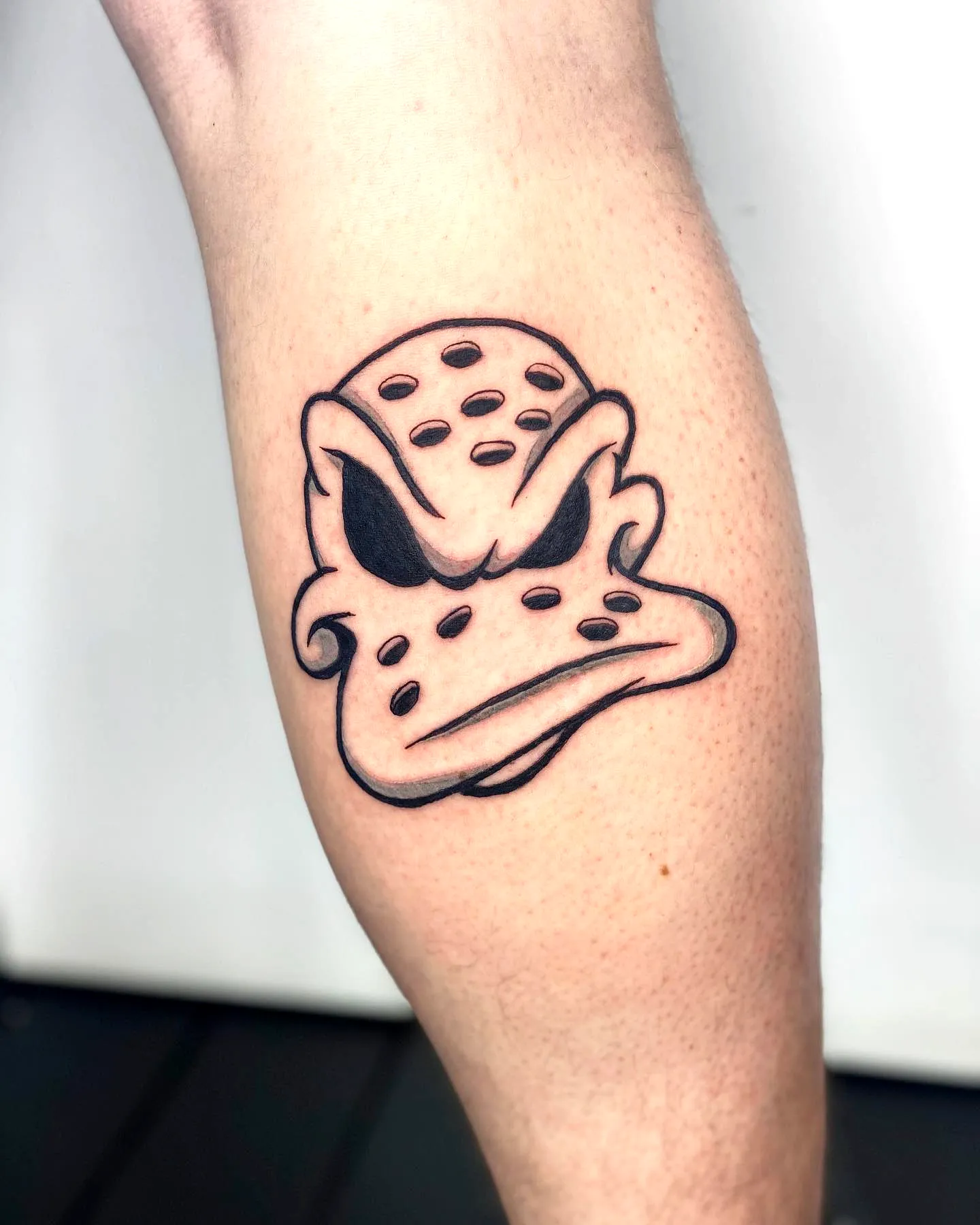 Frog Calf Tattoo in Bold Cartoon Style
