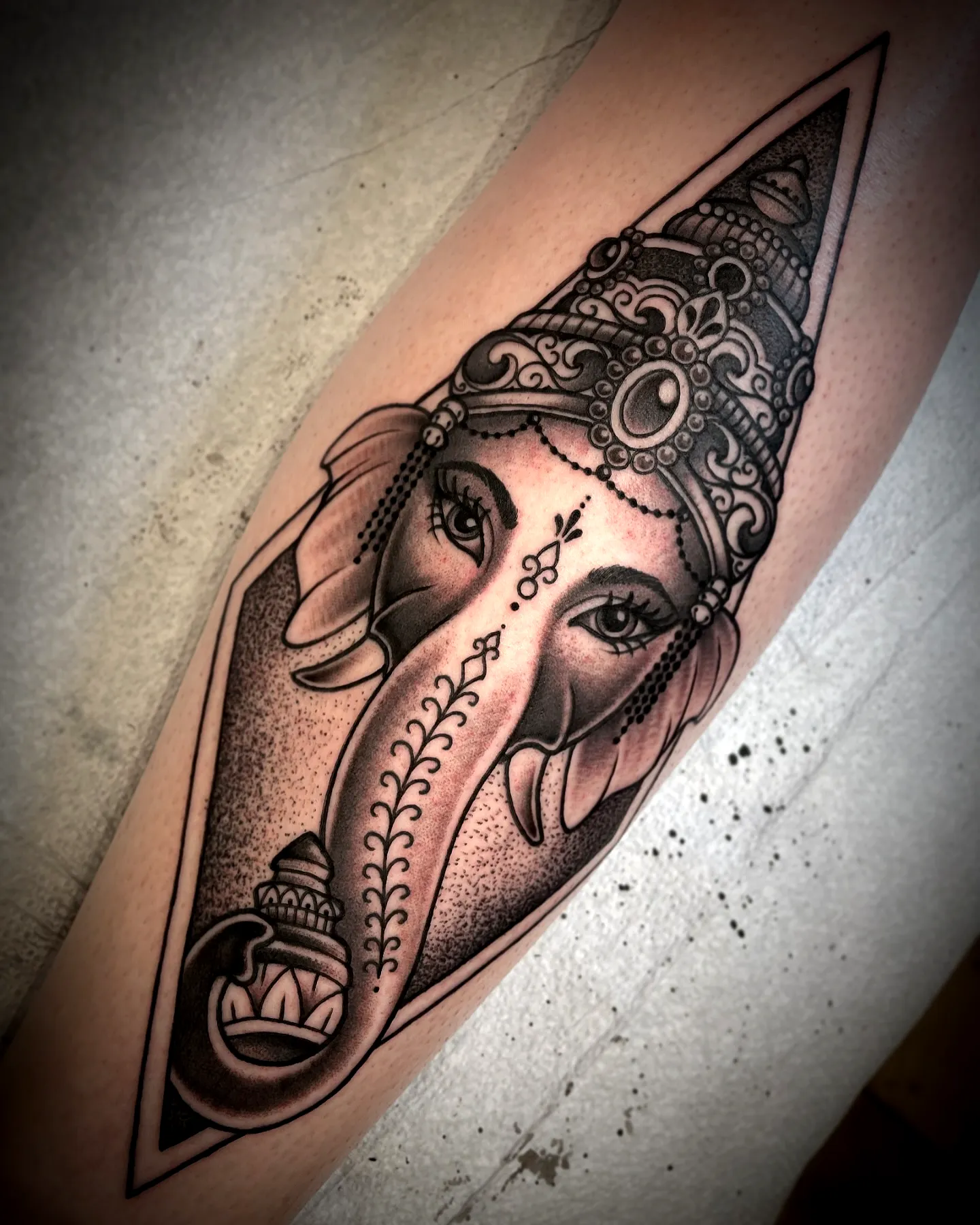 Ganesha Forearm Tattoo in Black Ink