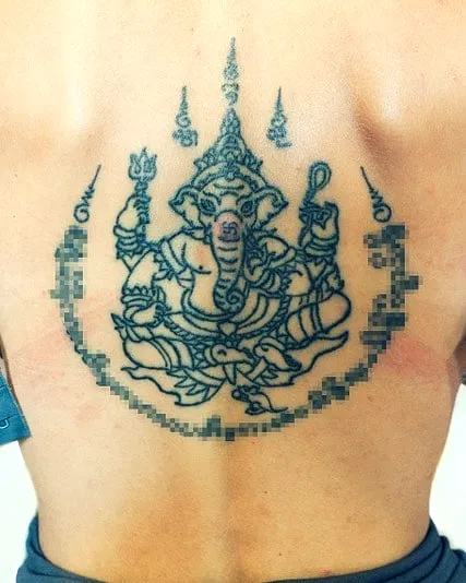 Ganesha Upper Back Tattoo in Black Ink