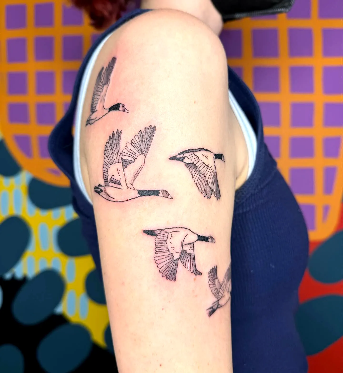 Geese Upper Arm Tattoo - Minimalistic Design