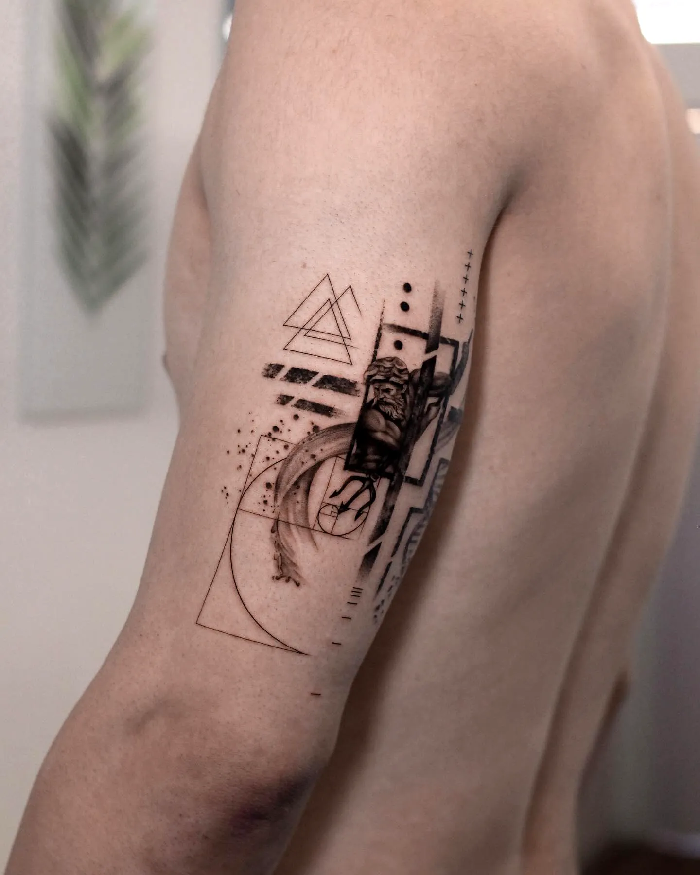 Geometric Black Upper Arm Tattoo