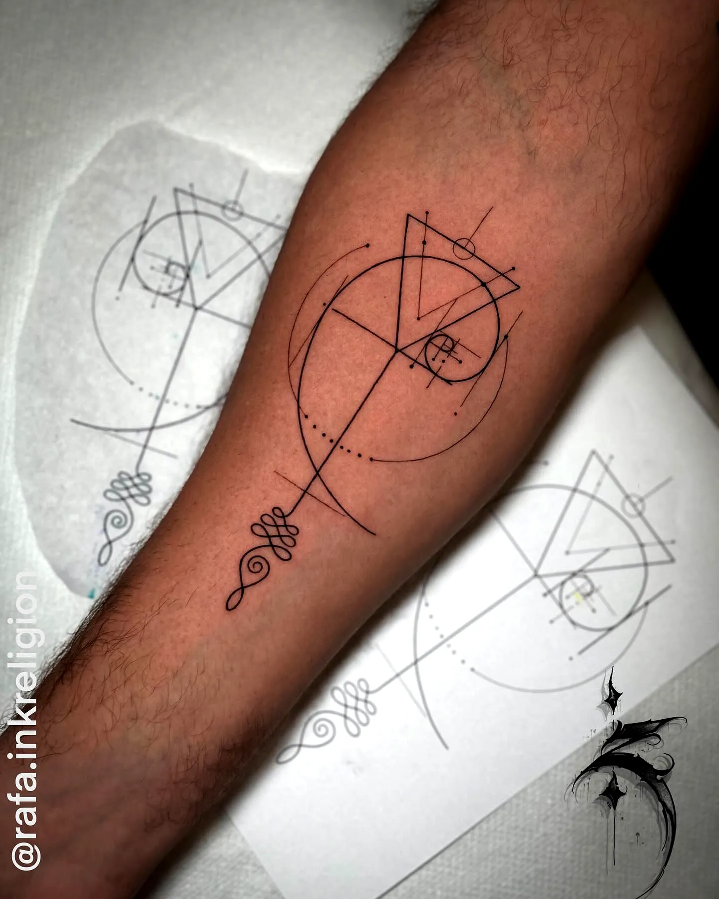 Geometric Forearm Tattoo in Black Ink