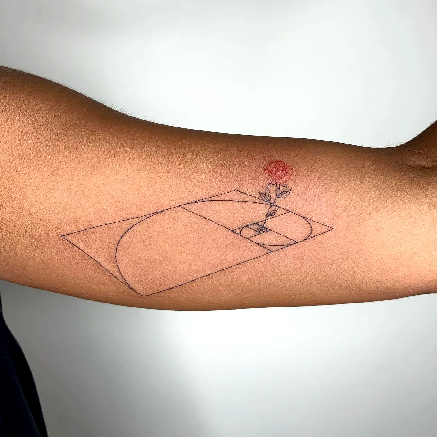 Geometric Rose Inner Arm Tattoo