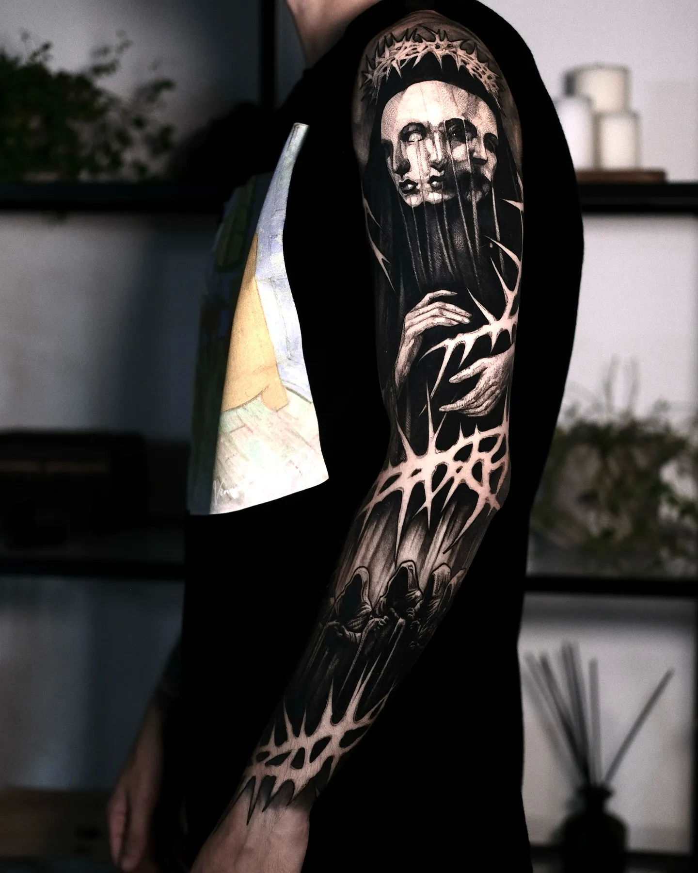 Ghostly Faces Forearm Sleeve Tattoo