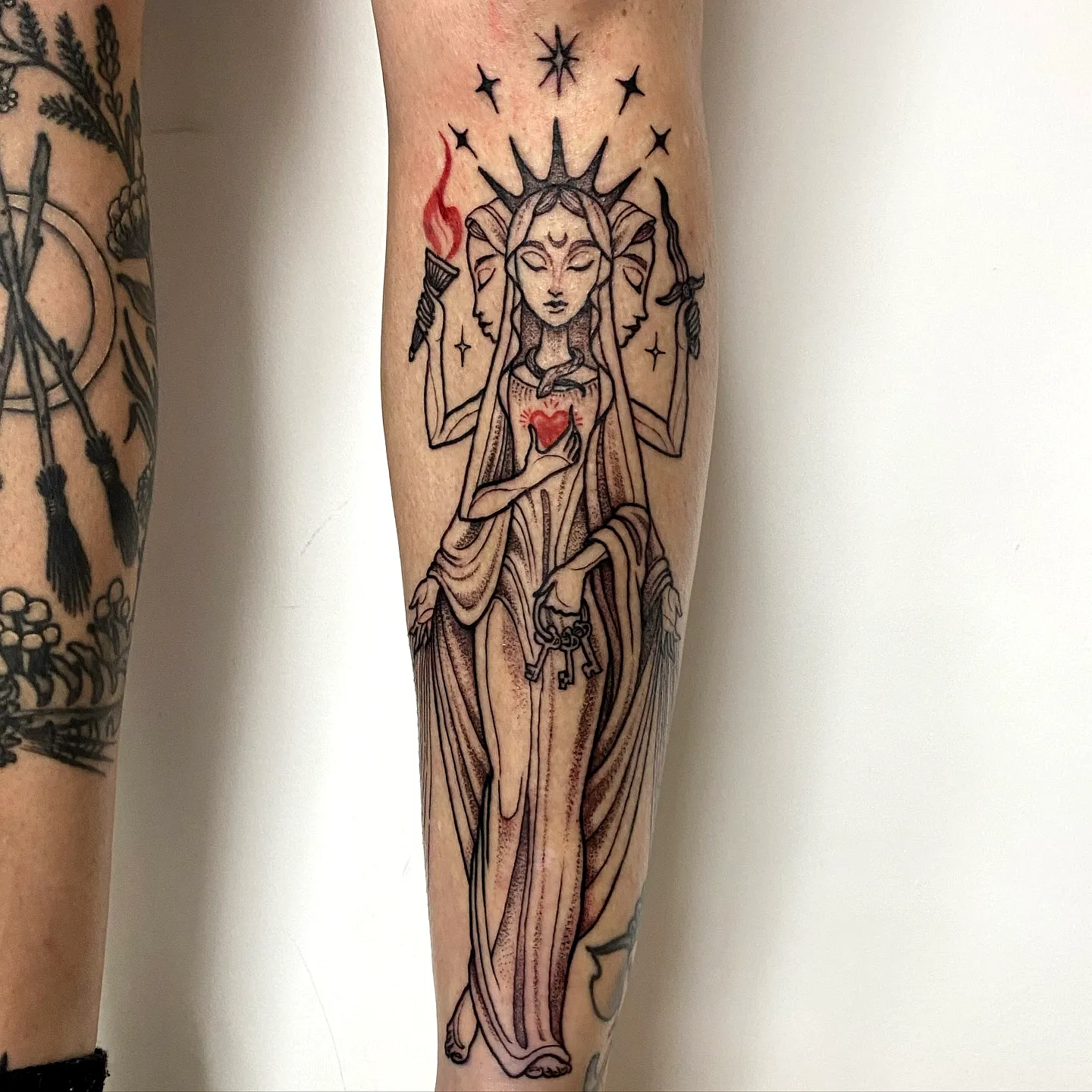 Goddess Forearm Tattoo with Heart and Flames