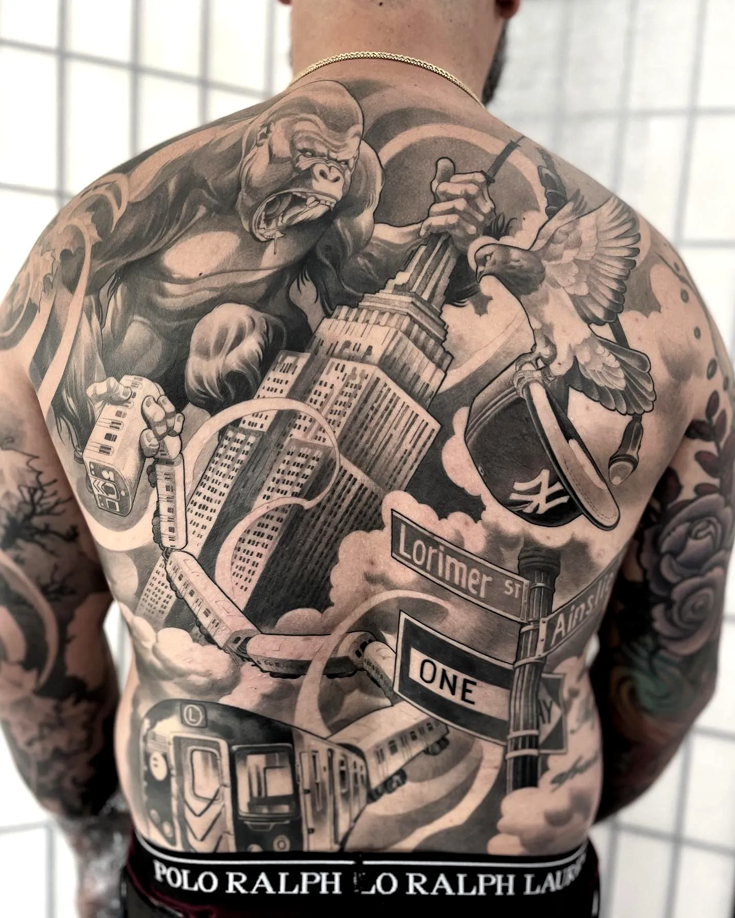 Gorilla Hawk Upper Back Tattoo