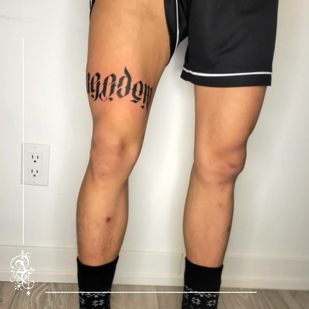 Gothic Script Inner Thigh Tattoo