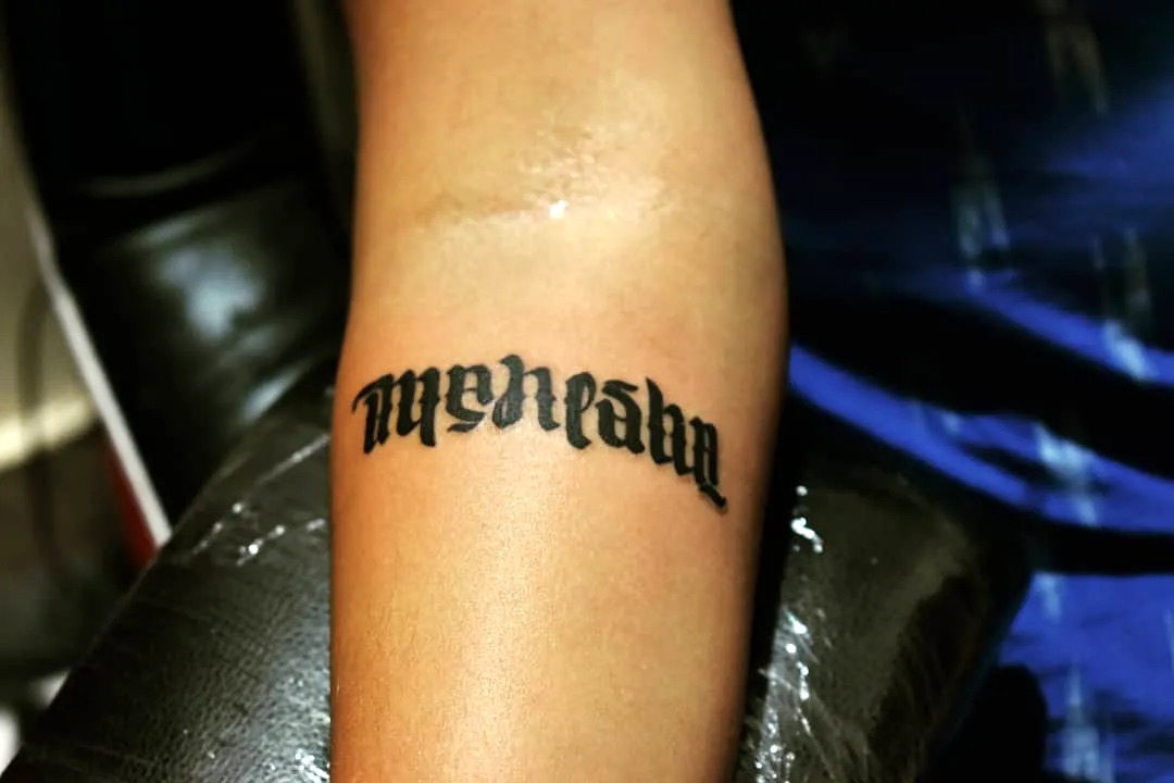 Gothic Weakness Forearm Tattoo