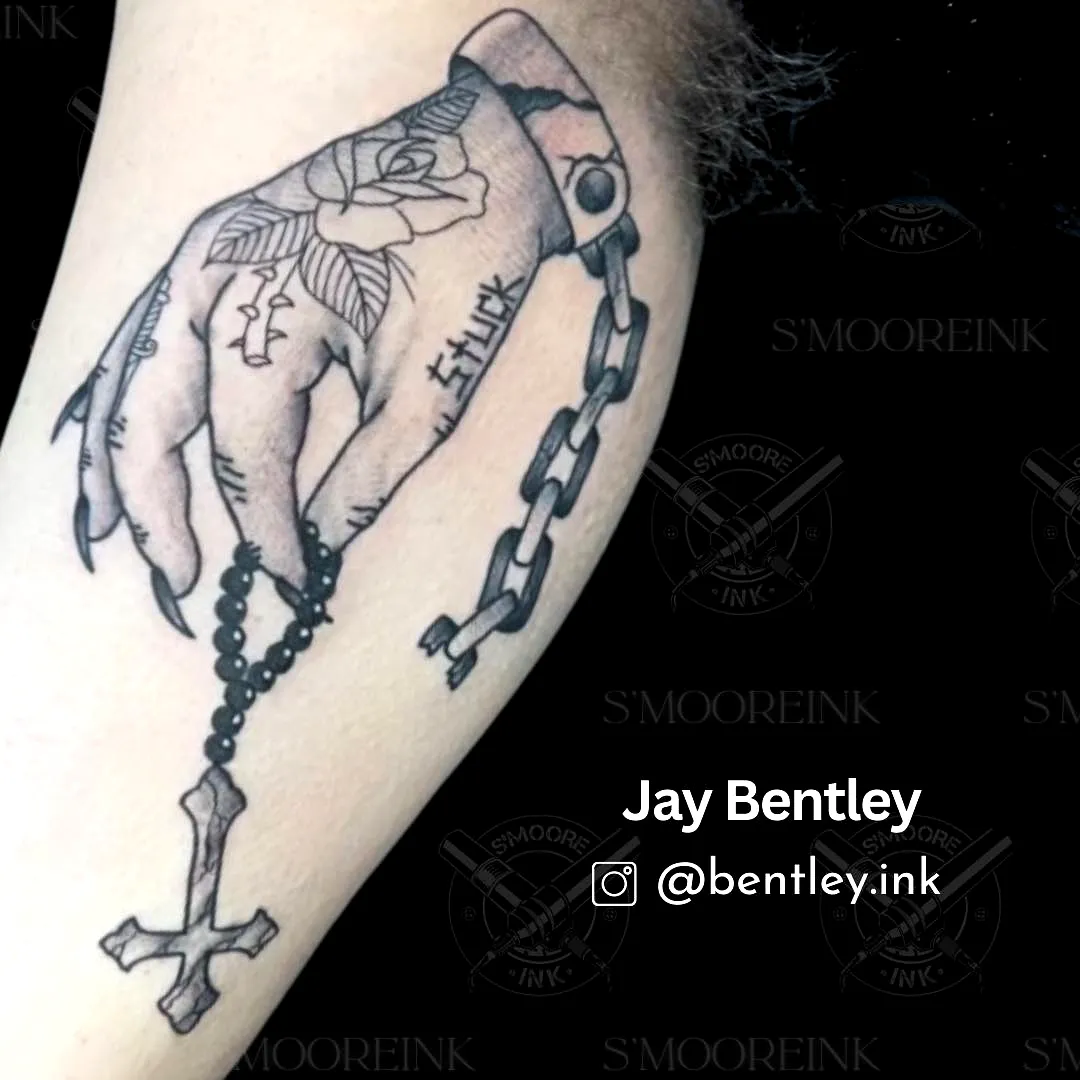 Hand rosary tattoo with rose