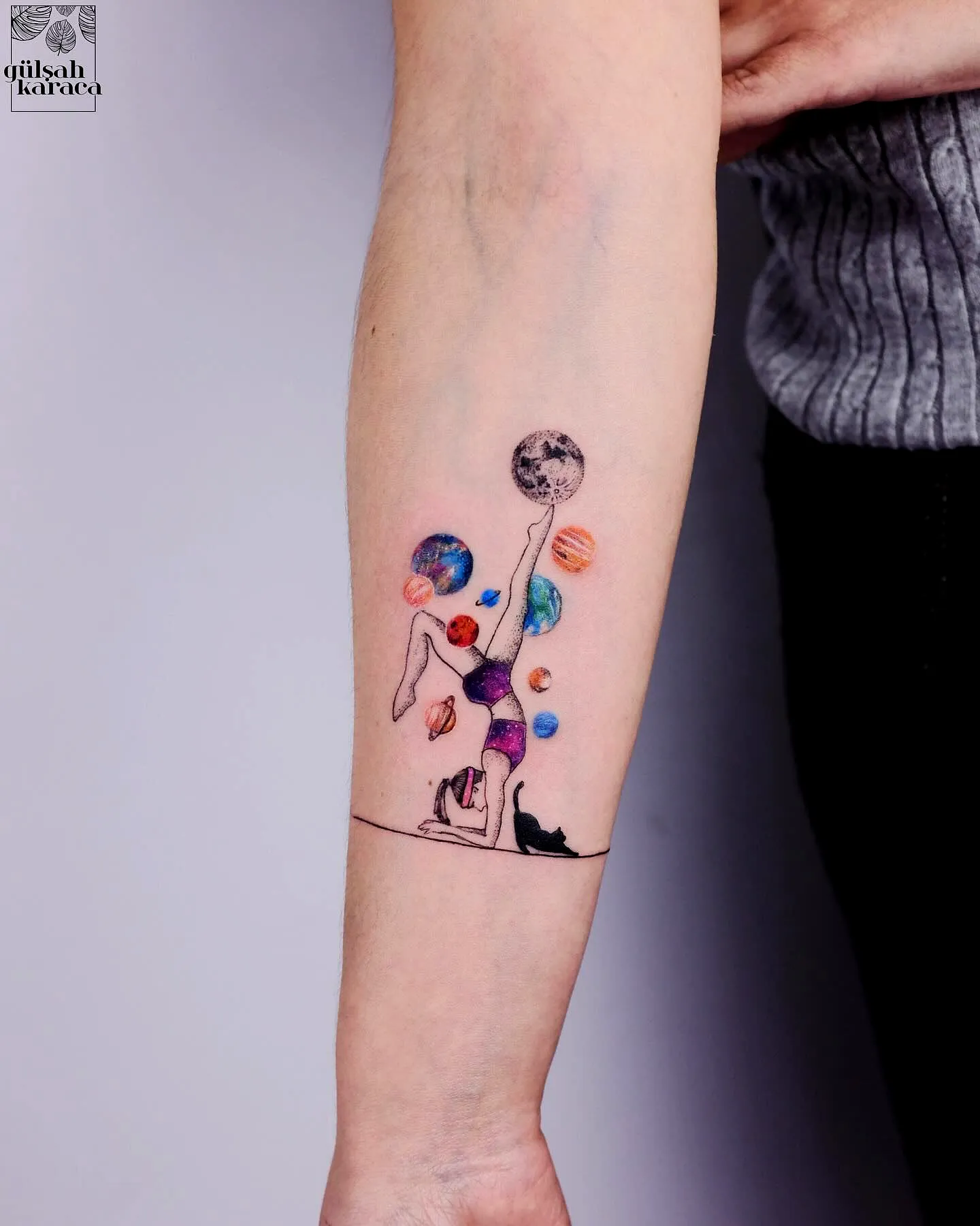 Handstand Figure Arm Tattoo with Planets
