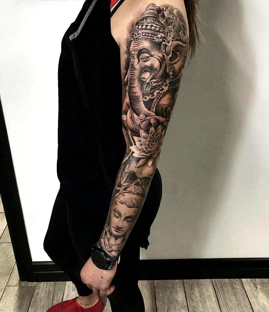 Hindu Ganesh Arm Tattoo with Lotus Flowers