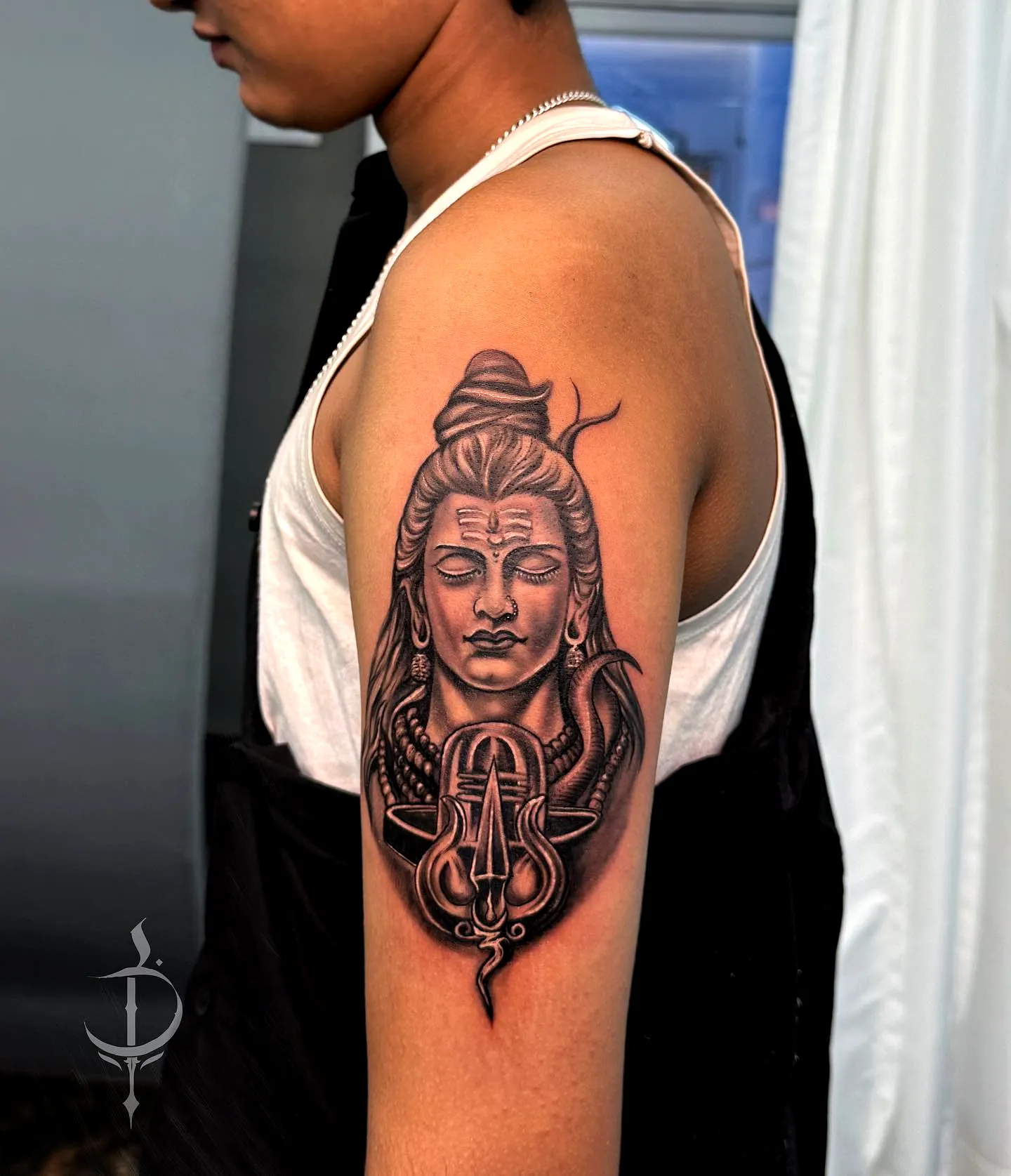 Hindu Shiva Upper Arm Tattoo in Black Gray