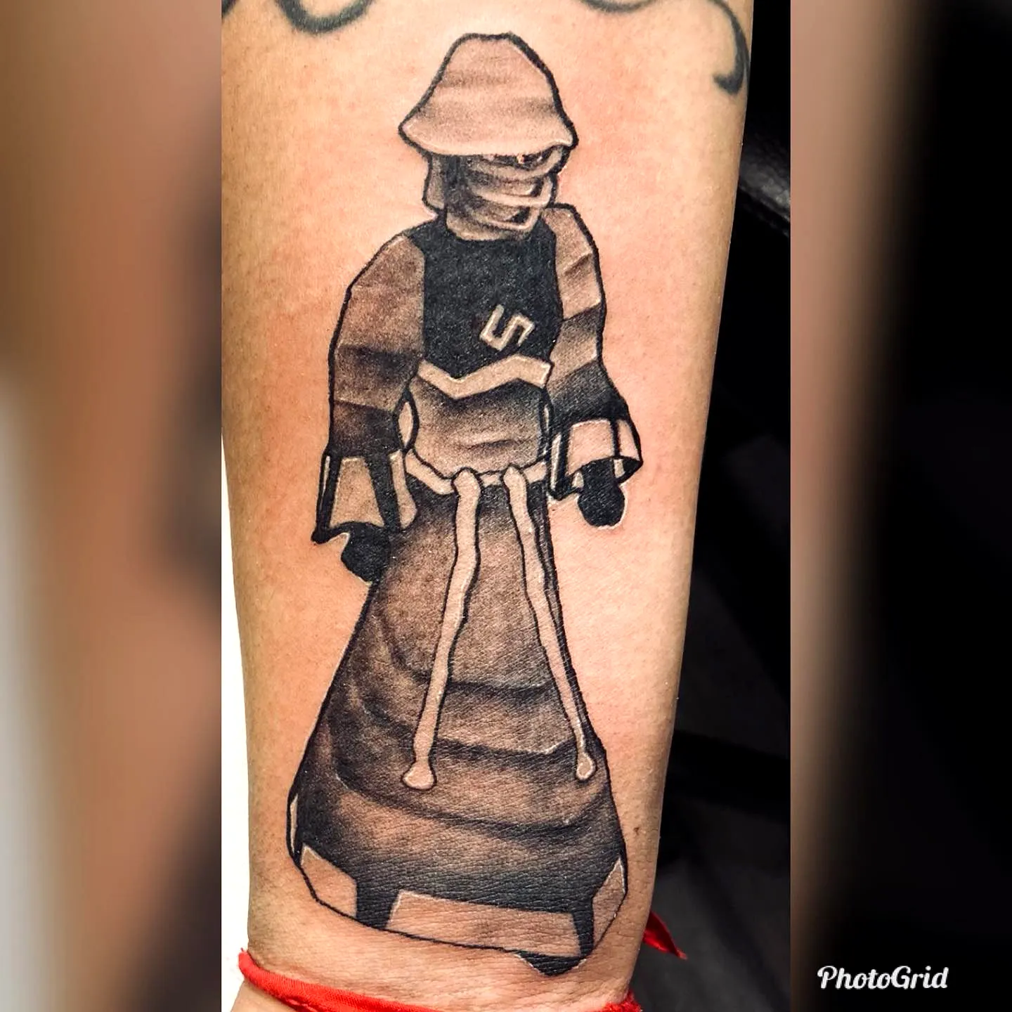 Hooded Figure Forearm Tattoo in Black and Grey