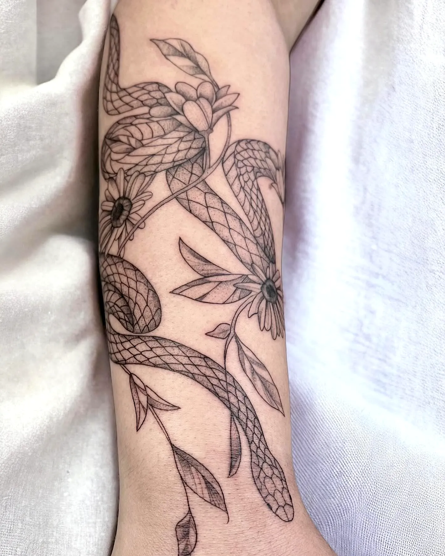 Intertwined Snakes Forearm Tattoo