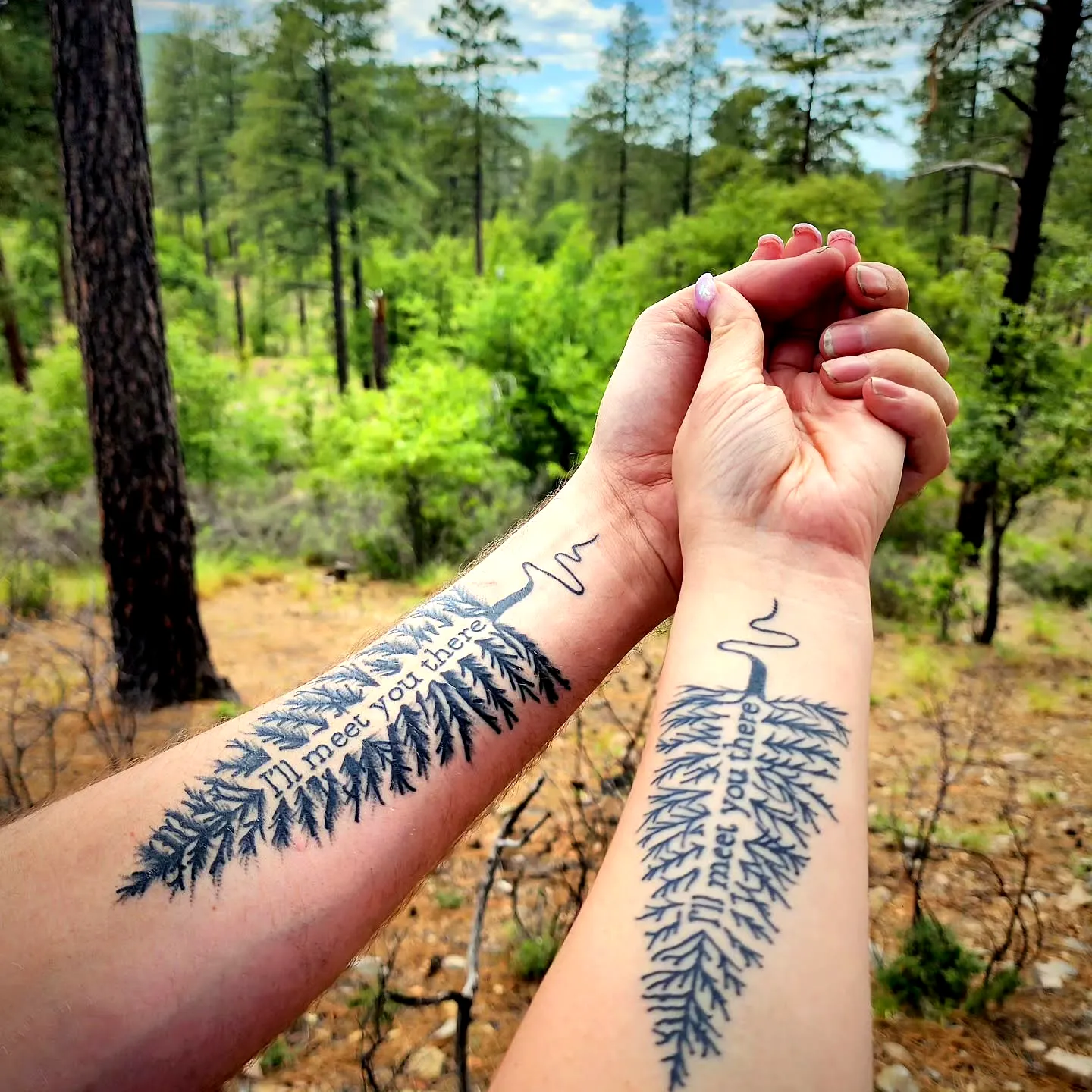 Intertwined Tree Arm Tattoos with Heartbeat